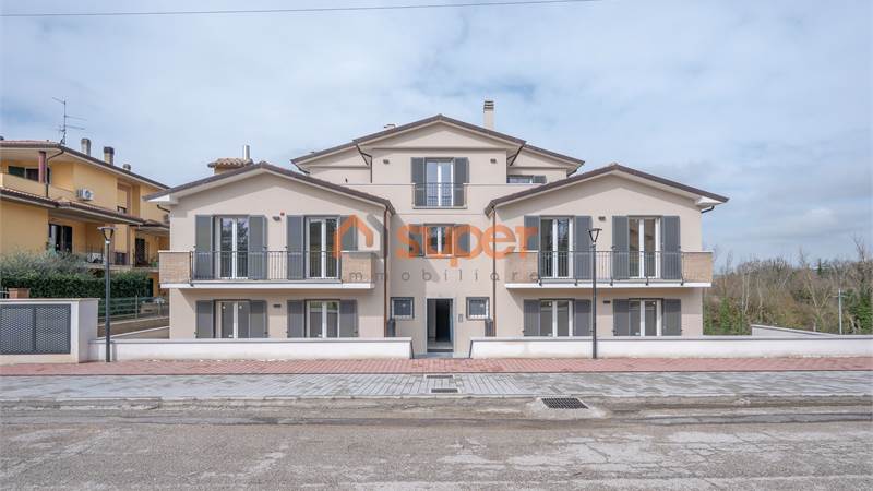 TRILOCALE CON GIARDINO PRIVATO IN PALAZZINA DI NUOVA COSTRUZIONE